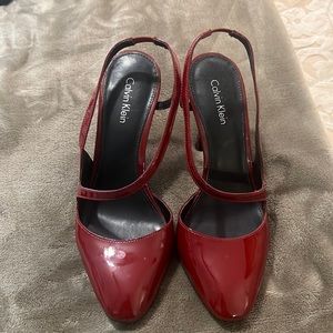 Red, patent leather slingbacks